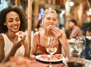 woman eating pizza