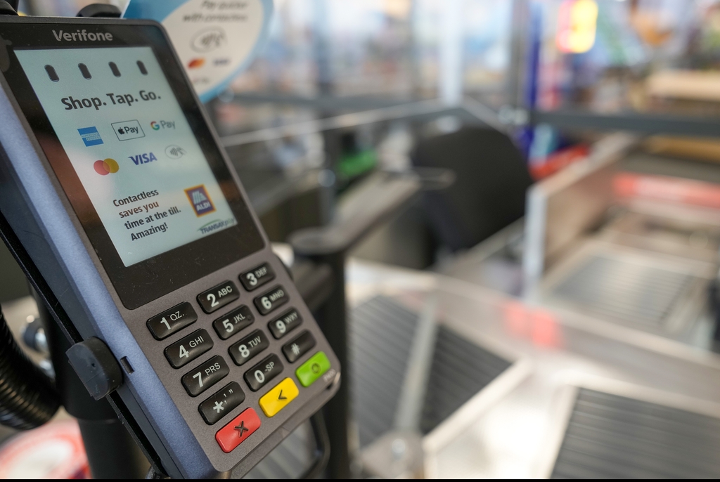 aldi cashier till scanning AI illinois