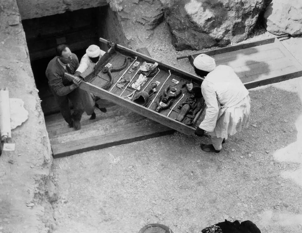 Workers remove a tray of chariot parts from Tutankhamun's tomb in 1922. Credit: Heritage Images / Getty