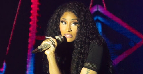 Nicki Minaj throws object at fan after getting hit by it onstage