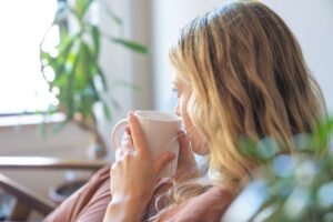 woman drinking hot drink
